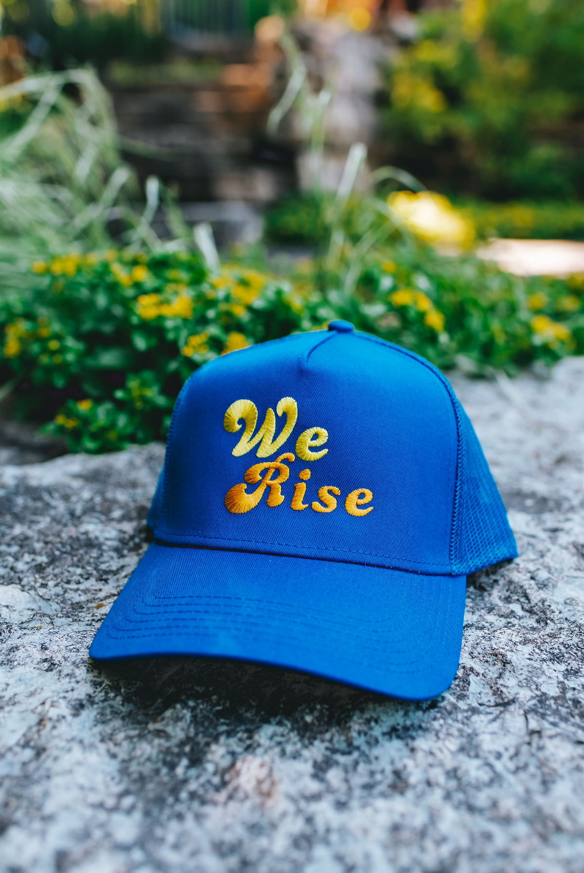 We Rise Trucker Hat